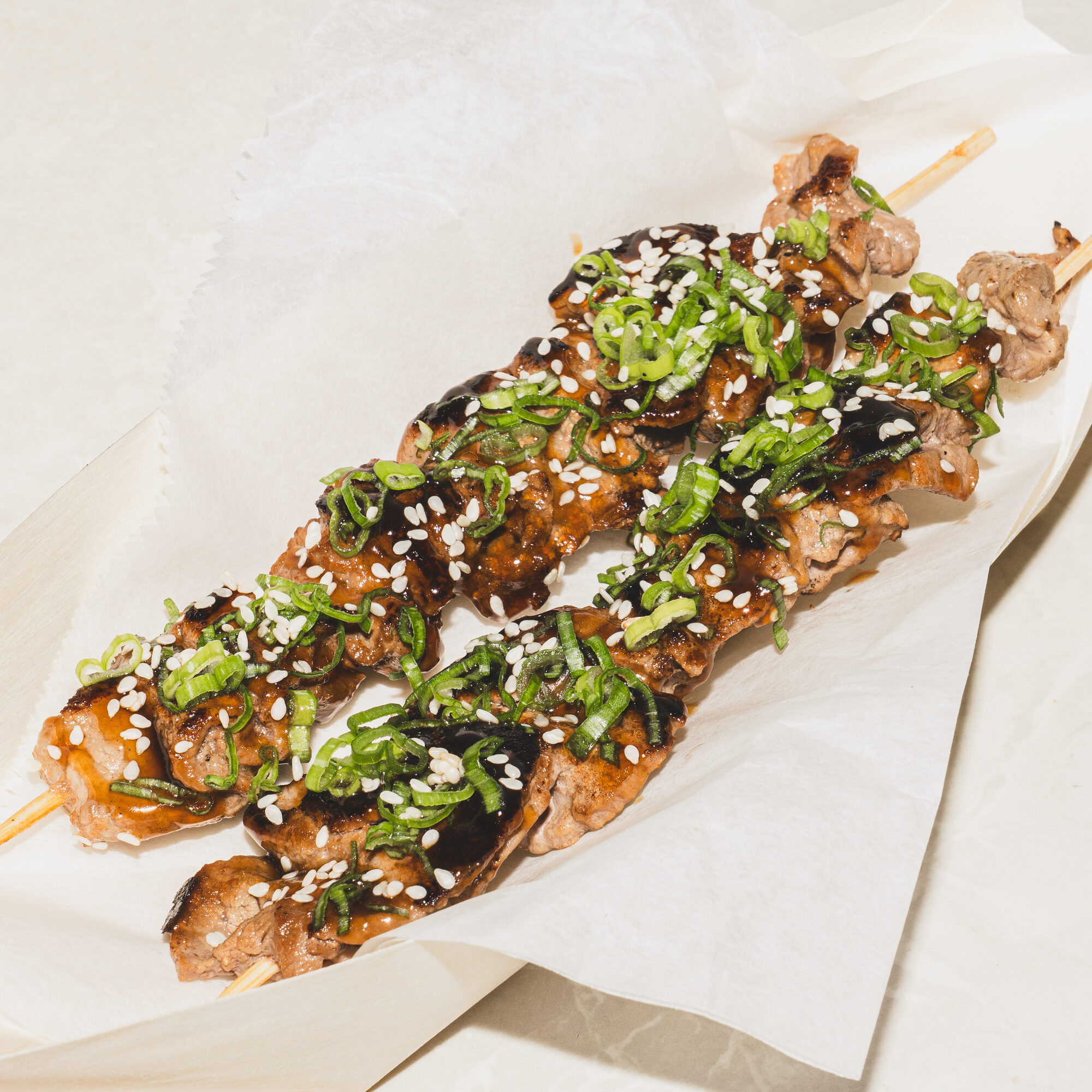 Charred skewer on parchment